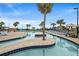 Inviting lazy river with mature palm trees and lounge area at 201 N Ocean Blvd. # 2536, Myrtle Beach, SC 29572