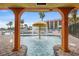 Inviting pool area featuring a mushroom fountain and tropical landscaping at 201 N Ocean Blvd. # 2536, Myrtle Beach, SC 29572