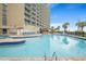 Large outdoor pool with water features and hotel in the background at 201 N Ocean Blvd. # 2536, Myrtle Beach, SC 29572