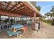 Outdoor restaurant seating with colorful picnic tables and beachfront views at 201 N Ocean Blvd. # 2536, Myrtle Beach, SC 29572
