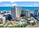 Expansive aerial view of an oceanfront resort featuring pools, waterslides, and modern architecture against a blue sky at 205 74Th Ave. N # 1104, Myrtle Beach, SC 29572