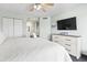 Bedroom showcasing a TV and a dresser with a view into the bathroom at 205 74Th Ave. N # 1104, Myrtle Beach, SC 29572