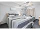 Cozy bedroom featuring a ceiling fan and two beds with neatly arranged towels at 205 74Th Ave. N # 1104, Myrtle Beach, SC 29572
