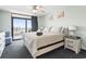 Bright bedroom featuring a balcony with ocean view and coastal-themed decor at 205 74Th Ave. N # 1104, Myrtle Beach, SC 29572
