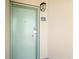 Exterior view of unit entrance door and wall light at 205 74Th Ave. N # 1104, Myrtle Beach, SC 29572
