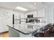 Bright kitchen with stainless appliances and granite counters, along with bar stool seating at 205 74Th Ave. N # 1104, Myrtle Beach, SC 29572