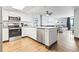 Open kitchen featuring stainless appliances, granite counters, and view into living area at 205 74Th Ave. N # 1104, Myrtle Beach, SC 29572