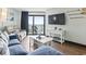 Relaxing living room showcasing balcony access and comfortable seating with ocean view at 205 74Th Ave. N # 1104, Myrtle Beach, SC 29572