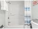 Bathroom featuring a shower-tub with blue and white striped curtain at 205 74Th Ave. N # 1104, Myrtle Beach, SC 29572