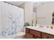 Cozy bathroom featuring tile floors, a vanity with a solid surface countertop, and a shower with a curtain at 2089 Suncrest Dr., Myrtle Beach, SC 29577