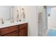 Bright bathroom featuring a vanity with a solid surface countertop, a mirror, and tile floors at 2089 Suncrest Dr., Myrtle Beach, SC 29577