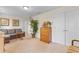 Comfortable bedroom featuring a sofa, a chest of drawers, a plant, carpeted floors and white doors at 2089 Suncrest Dr., Myrtle Beach, SC 29577