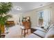 Comfortable bedroom featuring a sofa, a chest of drawers, a plant, carpeted floors and bright light at 2089 Suncrest Dr., Myrtle Beach, SC 29577