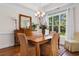 Bright dining room with natural light, stylish furniture, and wood flooring at 2089 Suncrest Dr., Myrtle Beach, SC 29577