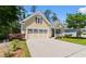 A lovely one-story home with a two-car garage and a beautifully landscaped front yard at 2089 Suncrest Dr., Myrtle Beach, SC 29577