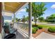 Inviting front porch with seating and a view of the landscaped neighborhood at 2089 Suncrest Dr., Myrtle Beach, SC 29577