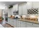 Well-appointed kitchen featuring white cabinets, granite counters, and stainless steel appliances at 2089 Suncrest Dr., Myrtle Beach, SC 29577