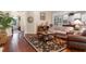 Cozy living room with hardwood floors and a view into the adjacent kitchen and dining areas at 2089 Suncrest Dr., Myrtle Beach, SC 29577