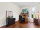 Charming office space with hardwood floors, desk, filing cabinet and natural light from the window at 2089 Suncrest Dr., Myrtle Beach, SC 29577