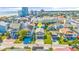 Aerial view of a house on a coastal street with a backdrop of city buildings and ocean at 209 25Th Ave. N, North Myrtle Beach, SC 29582