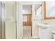 Bathroom featuring a shower, window and a view through the door into another carpeted room at 209 25Th Ave. N, North Myrtle Beach, SC 29582