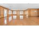 Expansive living room with hardwood floors and paneled walls with multiple windows at 209 25Th Ave. N, North Myrtle Beach, SC 29582