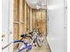 Outdoor shower featuring wood paneling, a shower head, and bikes stored inside at 209 25Th Ave. N, North Myrtle Beach, SC 29582