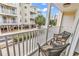 Relax on this balcony with views of the building exterior and blue skies at 209 Hillside Dr. N # 104, North Myrtle Beach, SC 29582