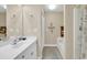 Well-lit bathroom with a single sink vanity, bathtub, and tiled floor at 209 Hillside Dr. N # 104, North Myrtle Beach, SC 29582