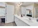 Bathroom featuring a double vanity, ample counter space, and access to the bedroom at 209 Hillside Dr. N # 104, North Myrtle Beach, SC 29582