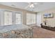 Tranquil bedroom with a seaside theme, balcony access, and a wall-mounted television at 209 Hillside Dr. N # 104, North Myrtle Beach, SC 29582
