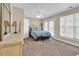 Bright bedroom featuring neutral tones, natural light, and a balcony view at 209 Hillside Dr. N # 104, North Myrtle Beach, SC 29582