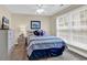 Cozy bedroom with a striped comforter, large window, and dresser at 209 Hillside Dr. N # 104, North Myrtle Beach, SC 29582
