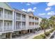Charming condo complex with private balconies, nestled among lush greenery and offering serene outdoor living at 209 Hillside Dr. N # 104, North Myrtle Beach, SC 29582