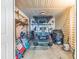 Garage with golf cart, bikes, beach chairs, and a propane tank at 209 Hillside Dr. N # 104, North Myrtle Beach, SC 29582