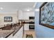 Modern kitchen featuring stainless steel appliances, granite countertops, and ample cabinetry for storage at 209 Hillside Dr. N # 104, North Myrtle Beach, SC 29582