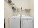 Laundry room with full-size Maytag washer and dryer and storage shelves at 209 Hillside Dr. N # 104, North Myrtle Beach, SC 29582