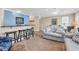 Spacious living room with a breakfast bar, comfortable seating, and stylish decor at 209 Hillside Dr. N # 104, North Myrtle Beach, SC 29582