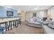 Spacious living room with a breakfast bar, comfortable seating, and stylish decor at 209 Hillside Dr. N # 104, North Myrtle Beach, SC 29582