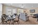 Bright living room with comfortable seating, a glass-top table, and a view to the balcony at 209 Hillside Dr. N # 104, North Myrtle Beach, SC 29582