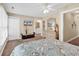 Bright main bedroom with ensuite bathroom, TV, ceiling fan and beach-themed décor at 209 Hillside Dr. N # 104, North Myrtle Beach, SC 29582