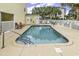 Enjoy the community pool with ample deck space and palms in the background at 209 Hillside Dr. N # 104, North Myrtle Beach, SC 29582