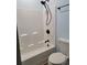 Bathroom featuring a tub with a matte black shower head and fixtures along with a white toilet at 214 Carolina Dr., Loris, SC 29569