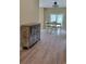Light-filled dining area with hardwood floors and views of the backyard, adjacent to cabinet at 214 Carolina Dr., Loris, SC 29569