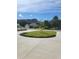 A circular driveway and beautifully landscaped yard leading to a well-maintained home at 214 Carolina Dr., Loris, SC 29569