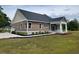 A beautifully landscaped home with a well-maintained lawn, showcasing great curb appeal at 214 Carolina Dr., Loris, SC 29569