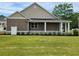 Beautiful home featuring a welcoming front porch and nicely landscaped front yard at 214 Carolina Dr., Loris, SC 29569