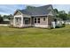 A home with well-maintained landscaping and a neatly manicured lawn, enhancing its curb appeal at 214 Carolina Dr., Loris, SC 29569