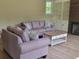 Comfortable living room featuring two plush sofas, a fireplace, built-in cabinets, and a stylish coffee table at 214 Carolina Dr., Loris, SC 29569