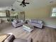 Bright living room showcasing a harmonious blend of seating arrangements and neutral color palettes at 214 Carolina Dr., Loris, SC 29569